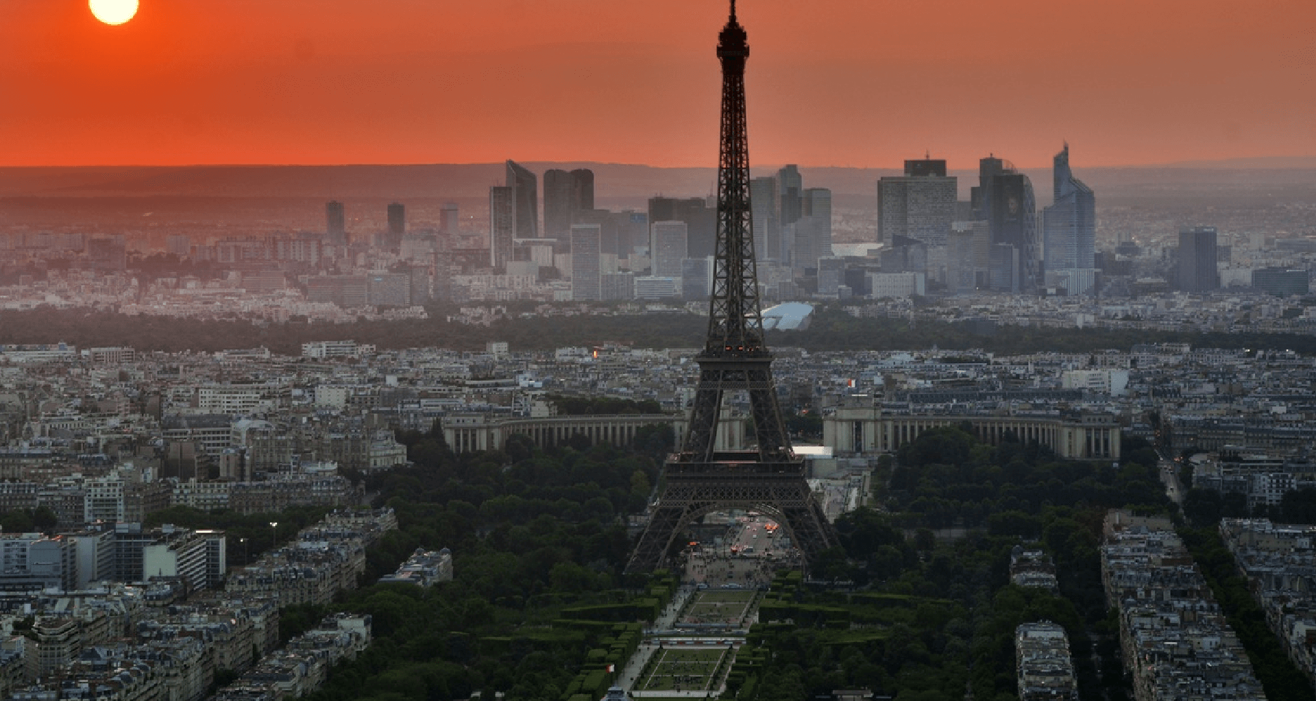 Eiffel Tower against sunset skyline